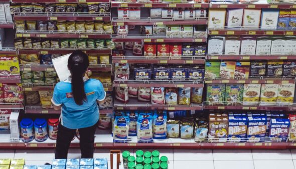 Woman Checking Inventory to Avoid Retail Stockout