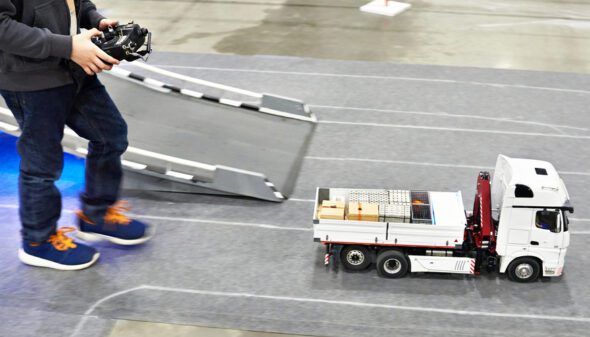 Child Playing with a Remote Control Car