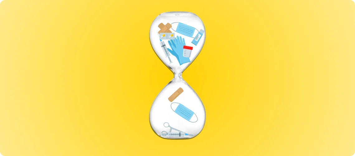Hourglass filled with hospital medical supplies, masks, syringes